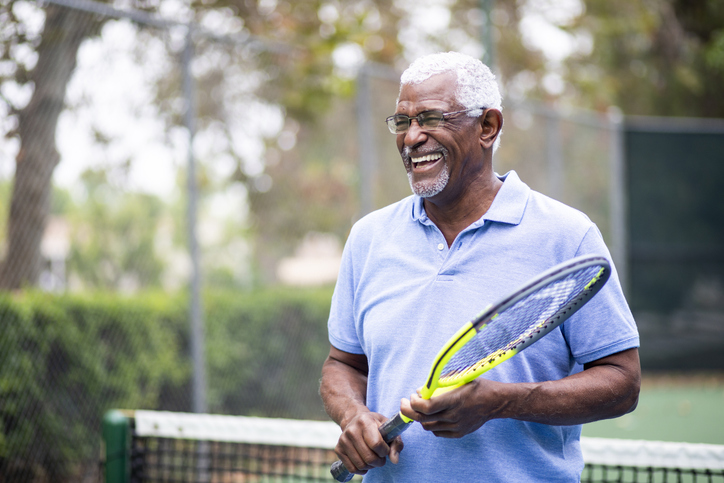 male playing tennis