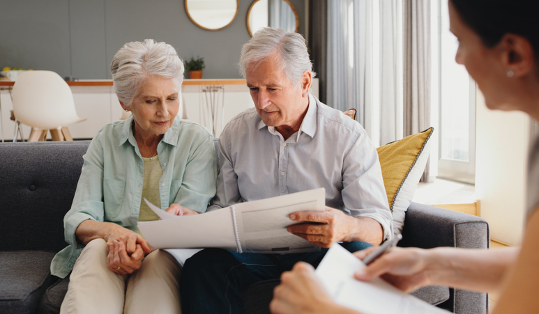 couple looking at newspaper